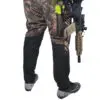 Person in camo pants holding an AR-15.