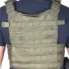 Green tactical vest with molle webbing.