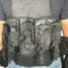 Black tactical vest with multiple pouches.
