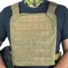 Tan tactical vest with molle webbing.