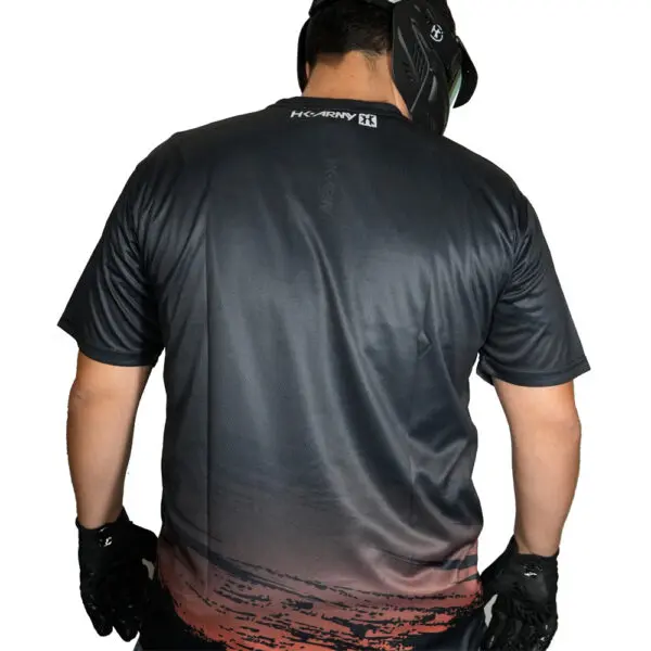 Man wearing black jersey and gloves.