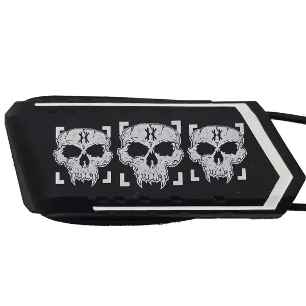 Black object with three white skulls design.