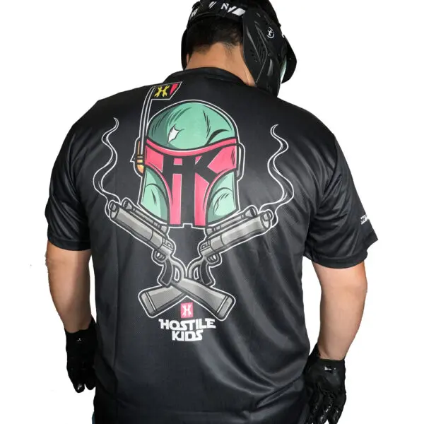 Man wearing helmet and graphic t-shirt.