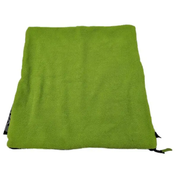 Green square cushion with textured fabric.