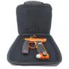 Orange paintball gun inside a black case.
