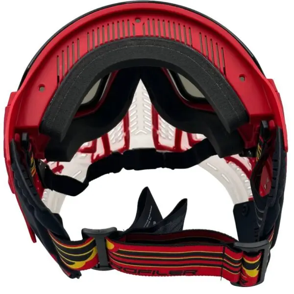 Red motocross helmet with goggles inside.