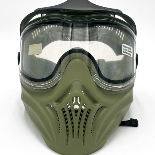 A green and black mask with goggles on top of it.