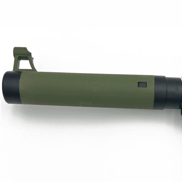 Green and black rifle barrel with sight.