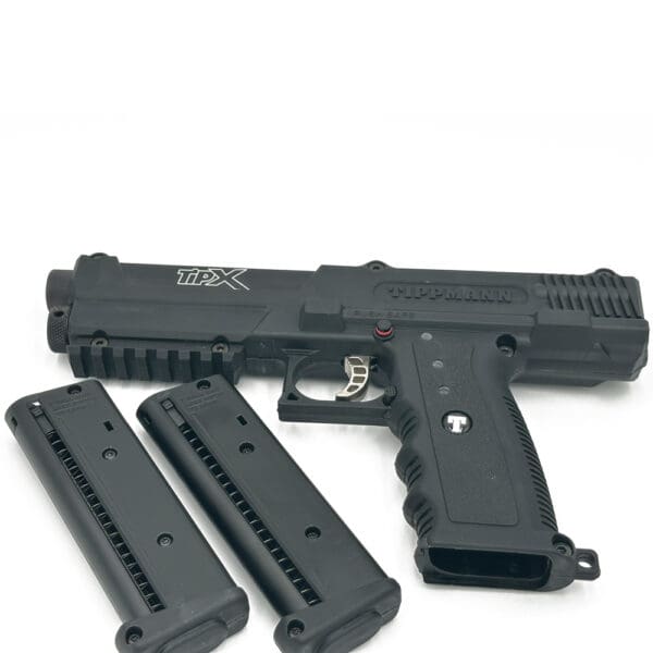 Black Tippmann TipX paintball pistol with magazines.