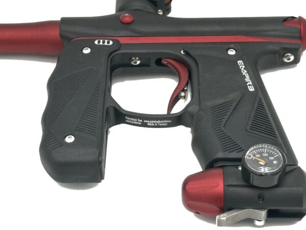 Black and red Empire paintball marker.