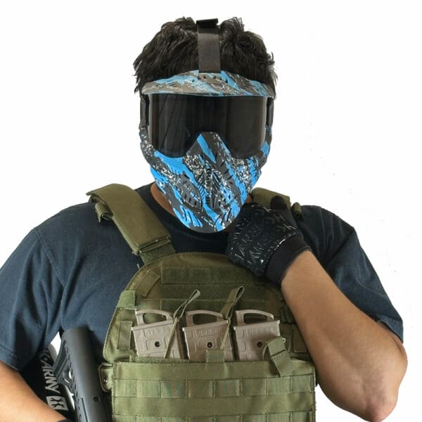 Person wearing a paintball mask and tactical gear.