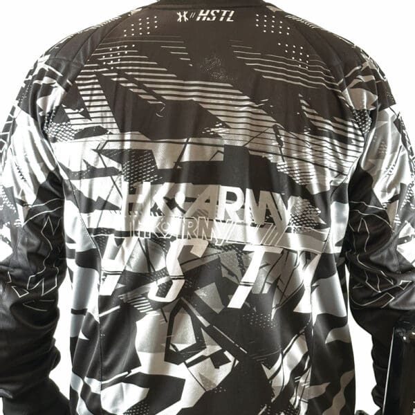 Black and white long-sleeve shirt with camo design.