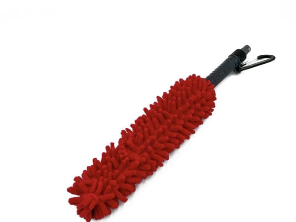 Red microfiber cleaning brush with a clip.