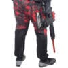 Person in red camo pants with paintball gun.