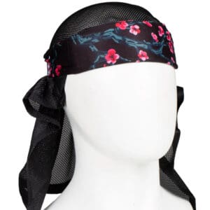 Black mesh headwear with pink flowers.