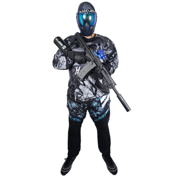 Paintball player with gun and mask.