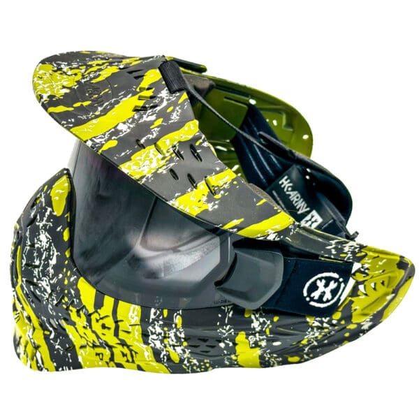 Black and yellow paintball mask with visor.