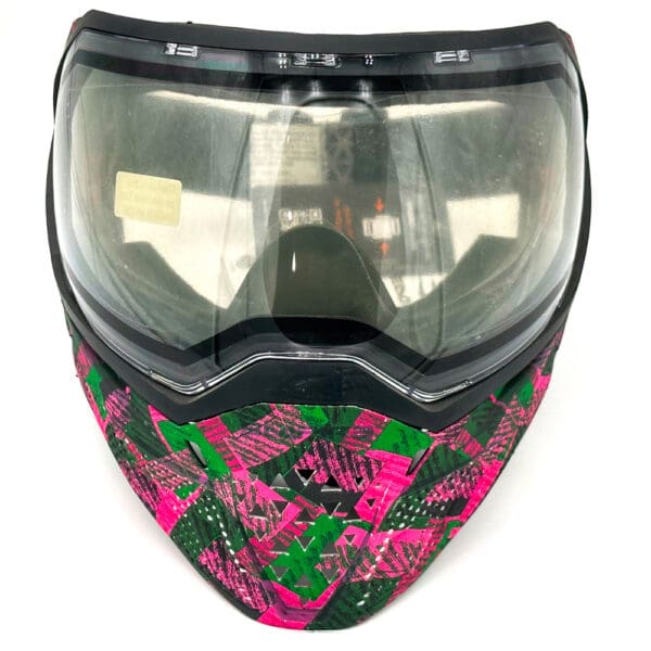 Pink and green paintball mask with clear lens.