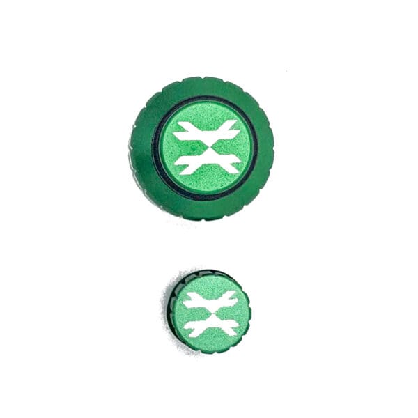 Two green knobs with white X logo.