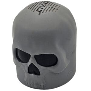 Gray skull-shaped Bluetooth speaker.