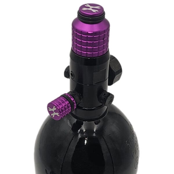 Purple and black paintball tank regulator.