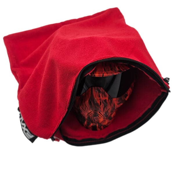 Red fleece goggle/mask carrying bag.