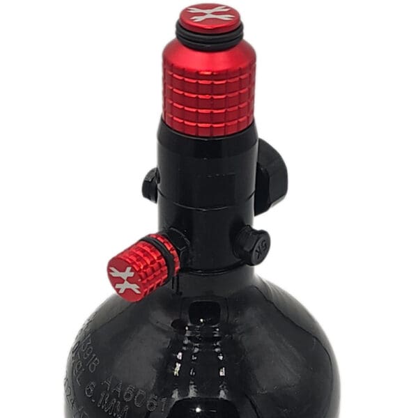 Red and black paintball tank regulator.