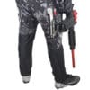Paintball player with marker in pants pocket.