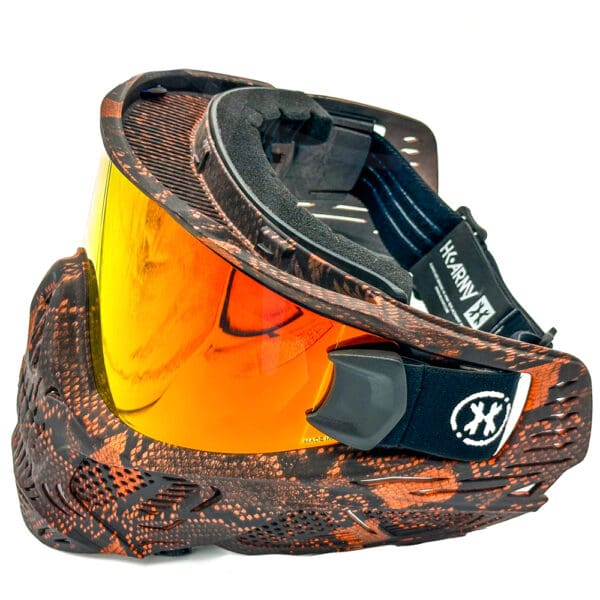 Brown and orange paintball mask with orange lens.