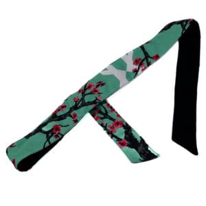 Green headband with cherry blossom print.