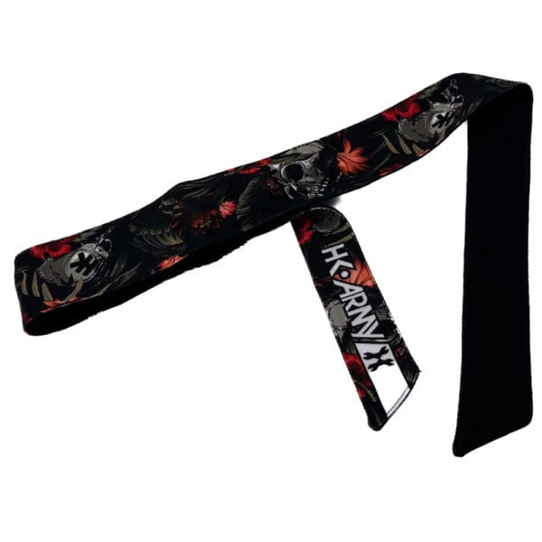 Black wrist wrap with skull and floral design.