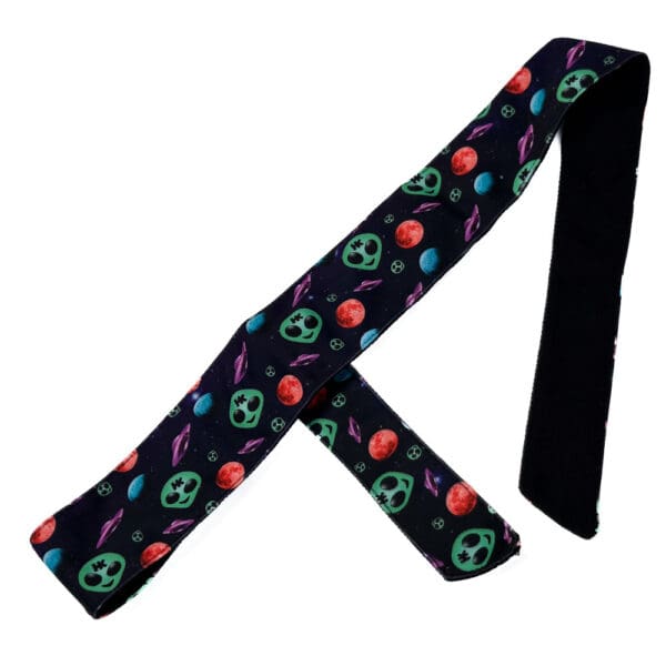 Black headband with alien and planet design.