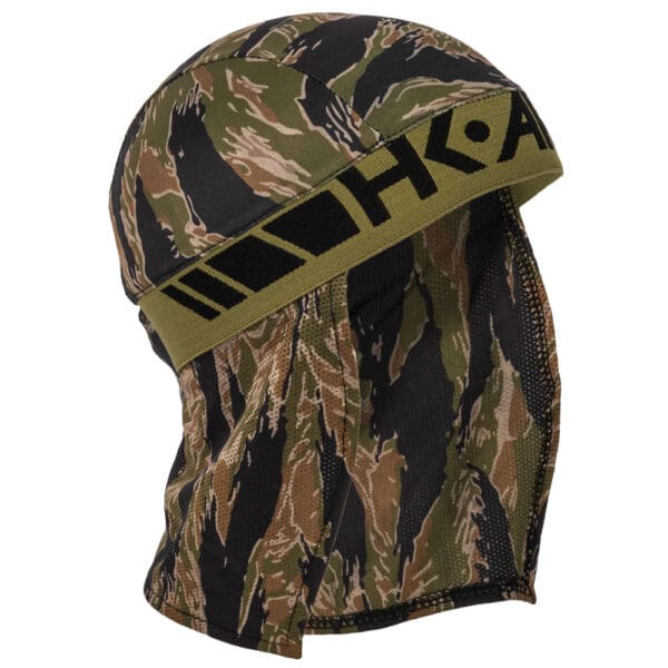 Camouflage headwear with "HKA" logo.