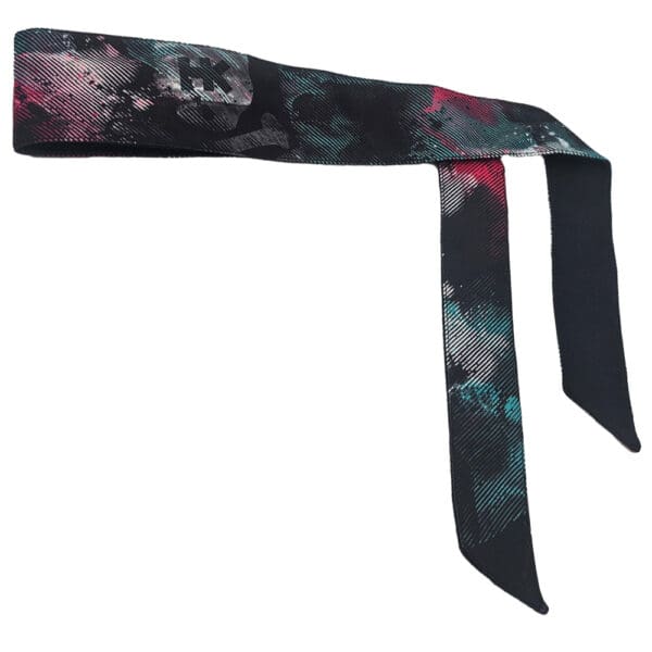 Here's an alt tag for the image: Abstract patterned headband.