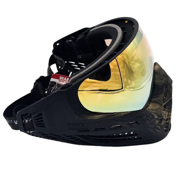 Black paintball mask with gold lens