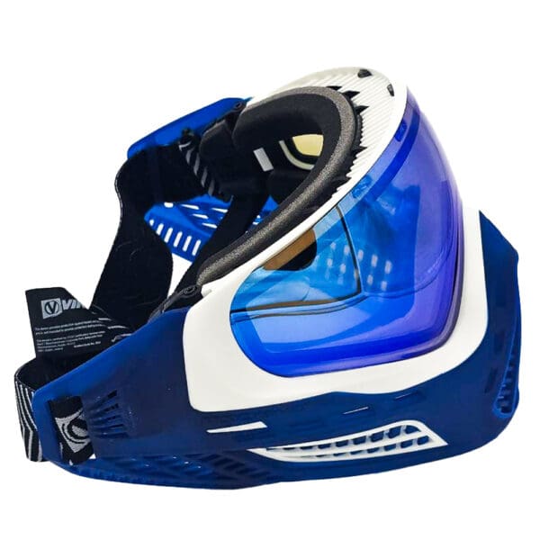 Blue and white paintball mask with lens.