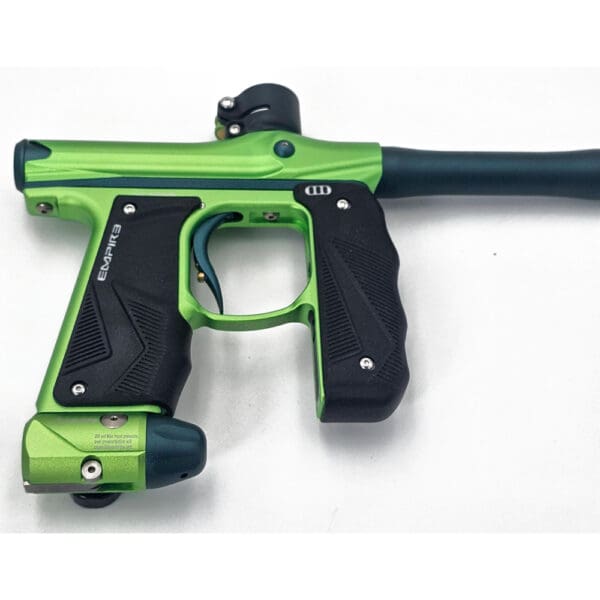 Green Empire paintball marker with black grip.