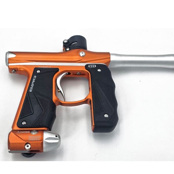 Orange and silver Empire paintball gun.