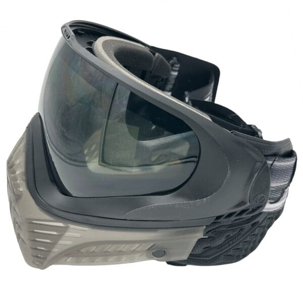 Black paintball mask with smoke lens.