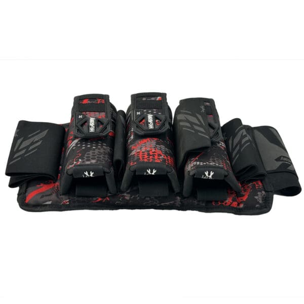 Here's an alt tag for the image: Red and black paintball pod pack.
