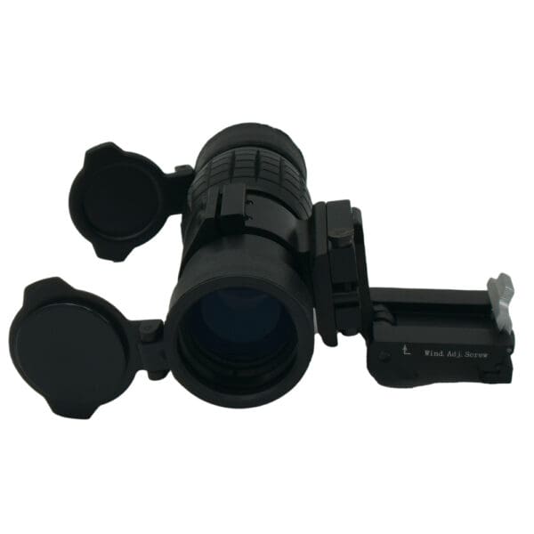 Black tactical rifle scope with caps.