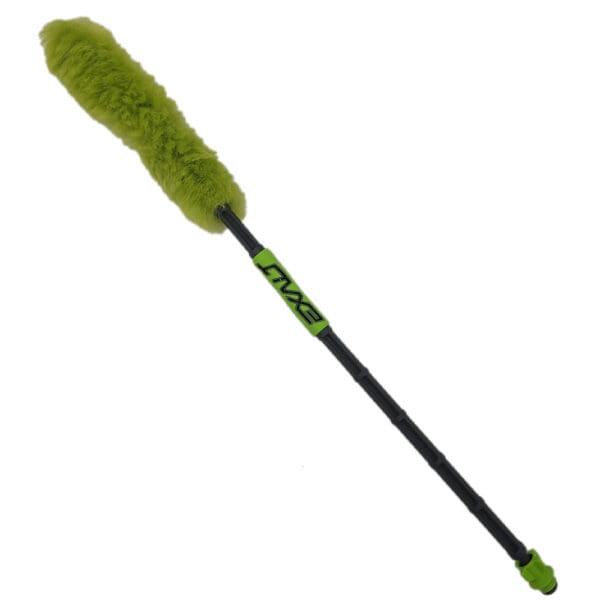 Green detailing brush with long handle.