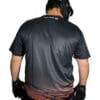 Man wearing black jersey and gloves.
