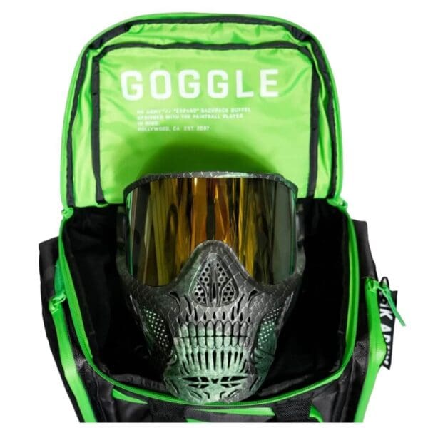 Paintball mask in open green backpack.