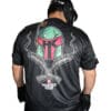 Man wearing helmet and graphic t-shirt.