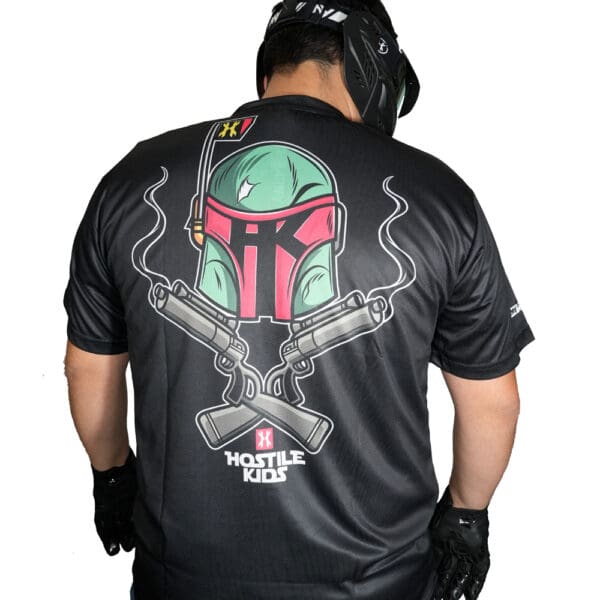 Man wearing helmet and graphic t-shirt.