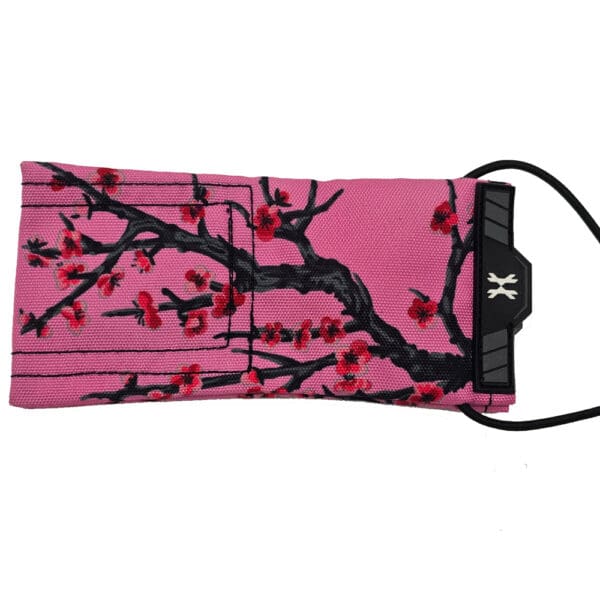 Pink face mask with cherry blossom design.