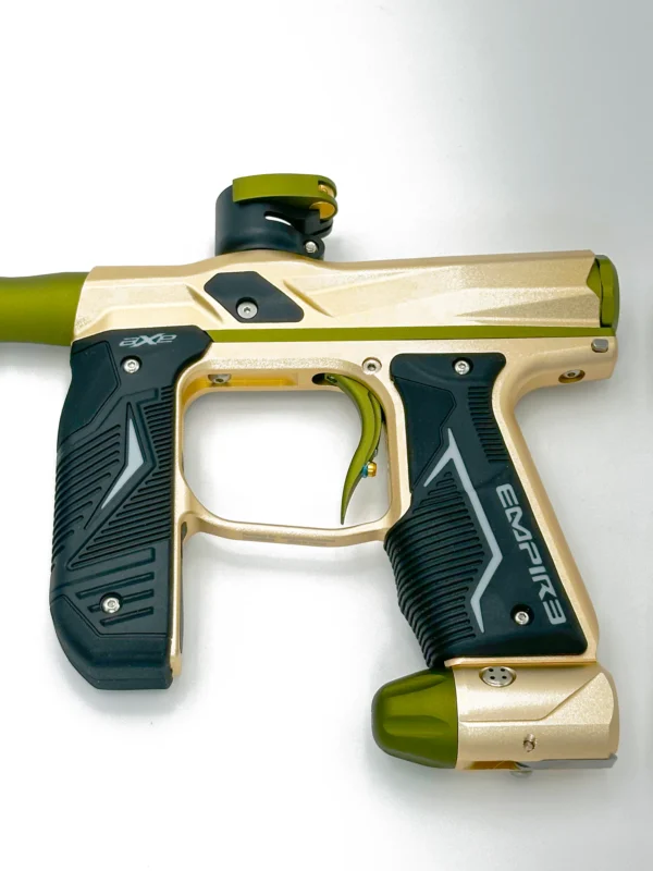 Gold and black paintball marker gun.
