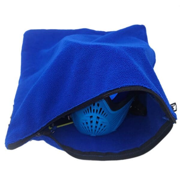 Blue mask partially inside a blue bag.