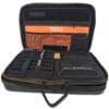 Tool case with organized compartments and pockets.
